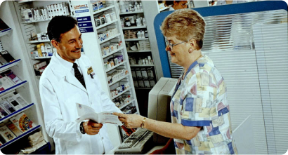 An Image of medicing store a women talking with pharmist