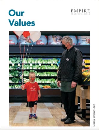 Text Reading 'Our values' with an image of a child and a woman in a grocery store where the child is holding balloons in his hands.