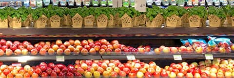 An image representing a particular section of a supermarket store filled with fruits and vegetables.