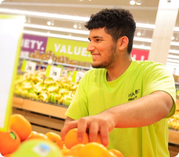An Image of a boy working at Sobeys store representing products.