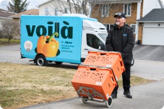 In Vaughan, ON, a Voilà by Sobeys colleague distributes shopping orders.
