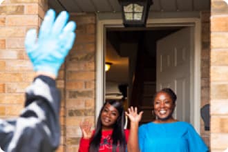 In Vaughan, ON, a Voilà by Sobeys teammate completes contactless delivery with clients.