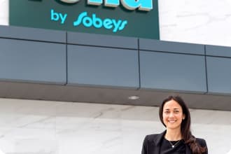 Outside of the Voilà by Sobeys Customer Fulfilment Centre in Vaughan, ON, stands Sarah Joyce, Senior Vice President of E-commerce.