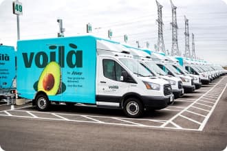 Outside the Customer Fulfilment Centre in Vaughan, Ontario, the Voilà by Sobeys fleet can be seen parked.